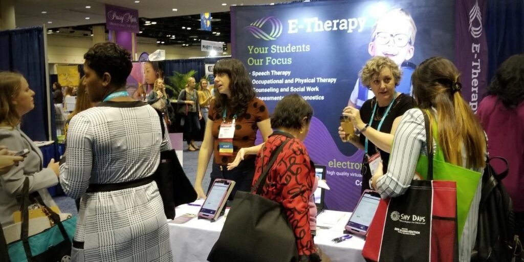 SLPs visit E-Therapy's booth at the 2019 ASHA Convention in Orlando, FL